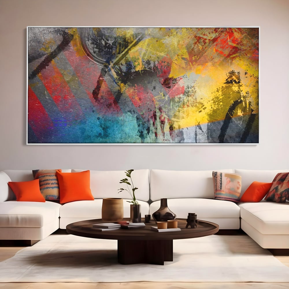 Tablou canvas cu pictura abstracta cu pete vibrante, in rama de aluminiu argintiu, pe perete intr-un living